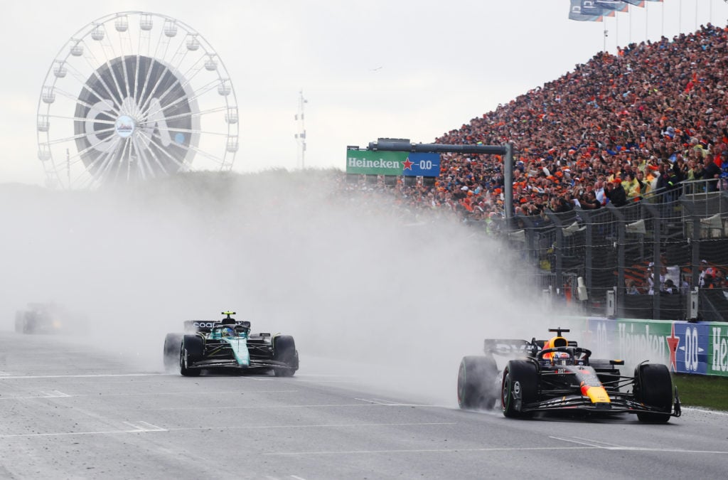 Red Bull driver Max Verstappen holds off Fernando Alonso of Aston Martin during F1 Dutch GP