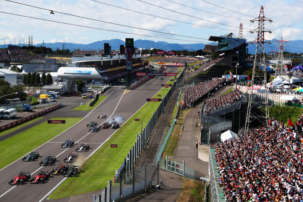 Red Bull driver Sergio Perez makes contact with Mercedes' Lewis Hamilton at start of F1 Japanese Grand Prix