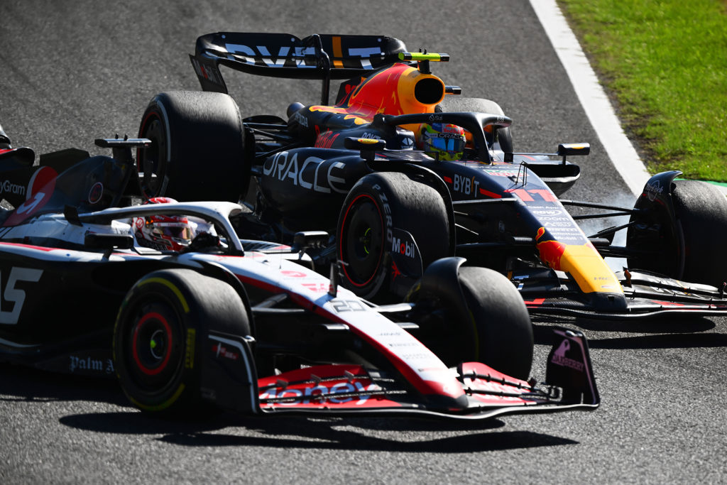 Red Bull driver Sergio Perez crashes with Haas' Kevin Magnussen at F1 Japanese GP