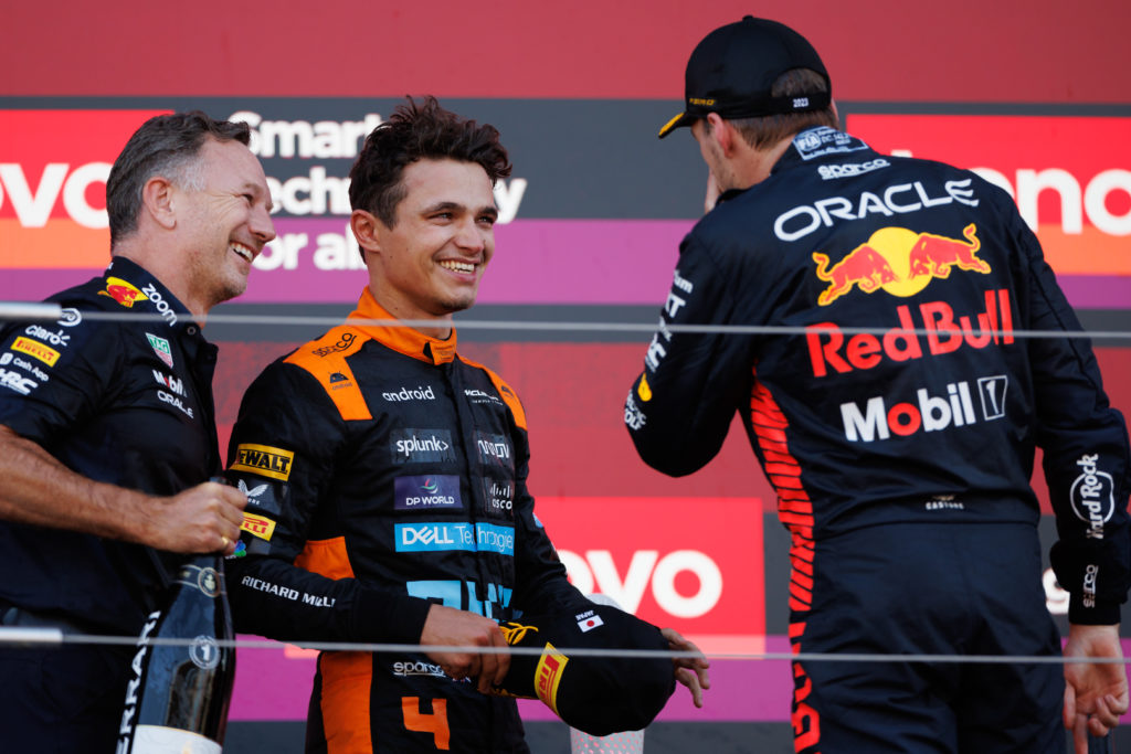 McLaren F1 driver Lando Norris celebrates Japanese GP podium with Red Bull driver Max Verstappen and team principal Christian Horner