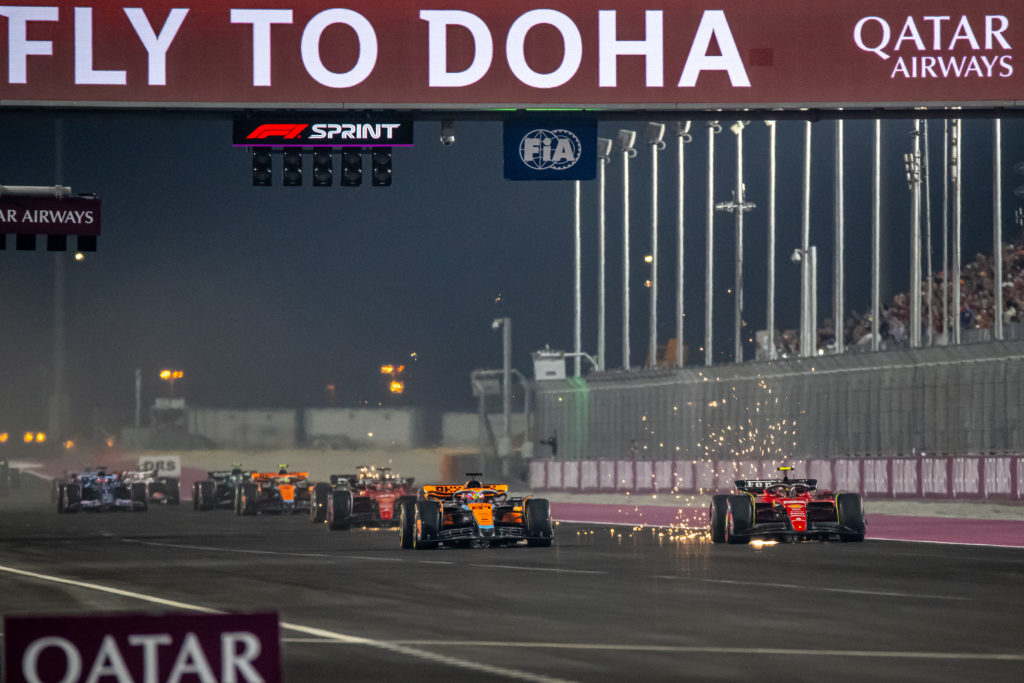 McLaren driver Oscar Piastri passes Carlos Sainz of Ferrari in Qatar GP Sprint