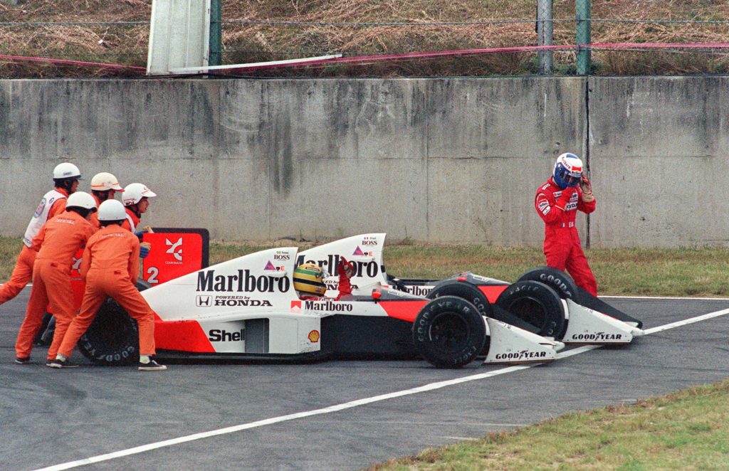 Alain Prost walks away from his McLaren after a crash with Ayrton Senna in the 1989 Japanese Grand Prix at Suzuka