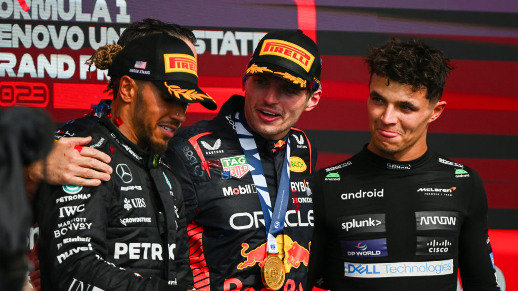 Mercedes, Red Bull and McLaren drivers Lewis Hamilton, Max Verstappen and Lando Norris on the F1 podium at the United States Grand Prix