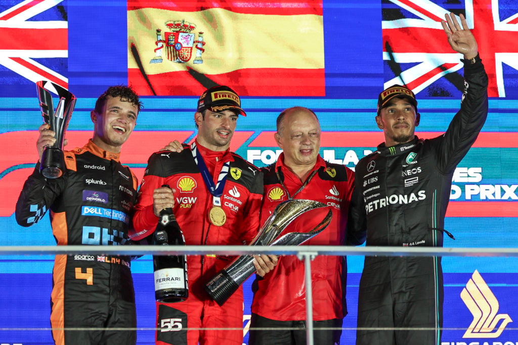 Ferrari boss Frederic Vasseur celebrates Carlos Sainz winning 2023 F1 Singapore GP with McLaren's Lando Norris and Mercedes' Lewis Hamilton