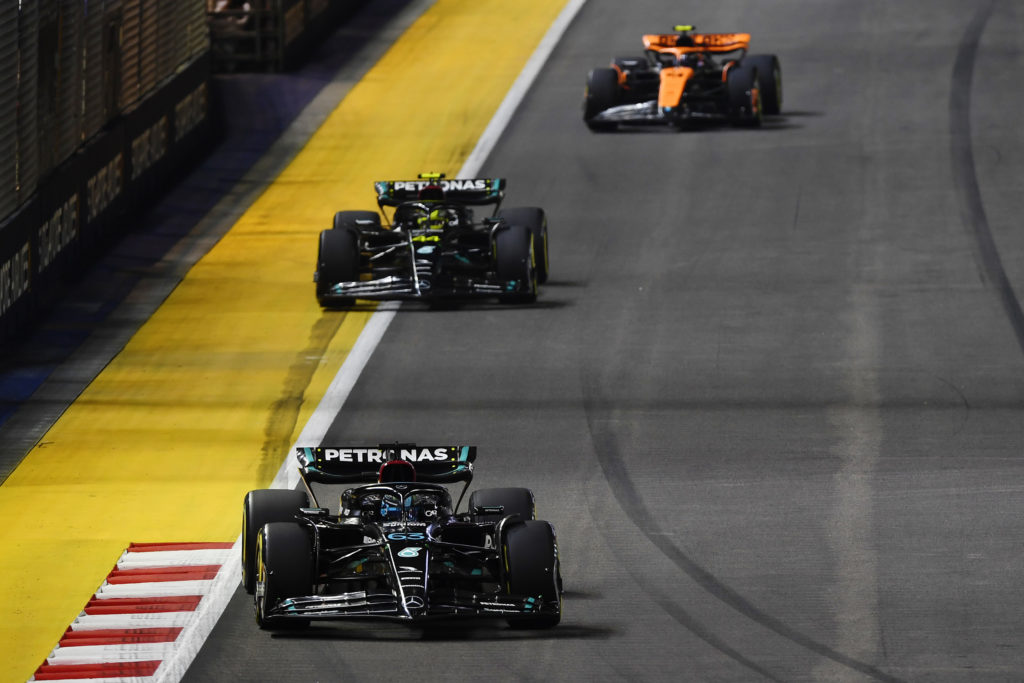 Mercedes drivers Lewis Hamilton and George Russell during 2023 F1 Singapore GP