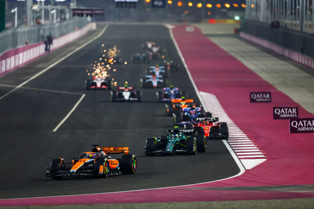 Aston Martin driver Fernando Alonso follows Oscar Piastri of McLaren at 2023 F1 Qatar GP