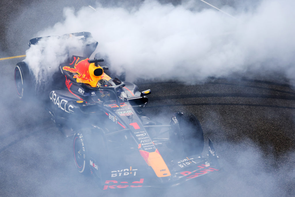 Red Bull driver Max Verstappen celebrates winning 2023 F1 Abu Dhabi GP as champion