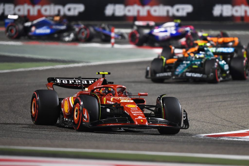 Carlos Sainz of Ferrari leads Fernando Alonso of Aston Martin at 2024 F1 Bahrain GP