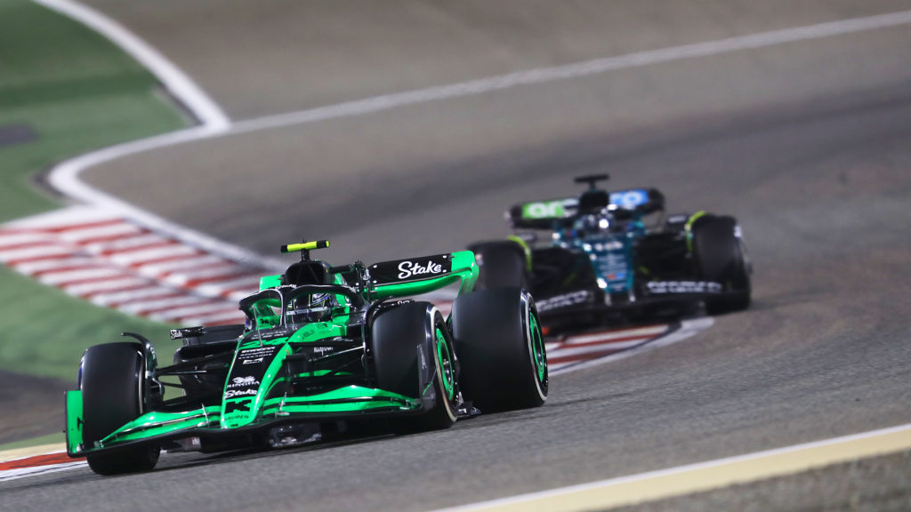 Stake F1 Team Sauber driver Zhou Guanyu defends from Lance Stroll of Aston Martin during 2024 Bahrain GP