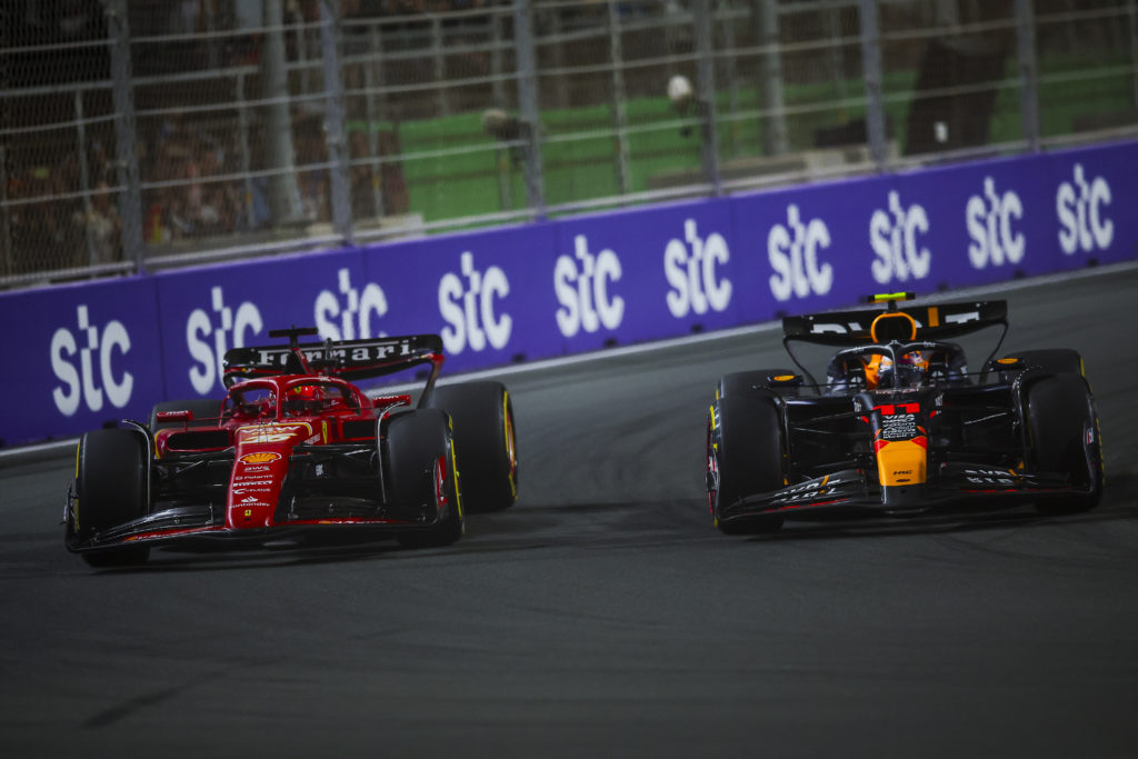 Red Bull driver Sergio Perez overtakes Charles Leclerc of Ferrari in 2024 F1 Saudi Arabian GP
