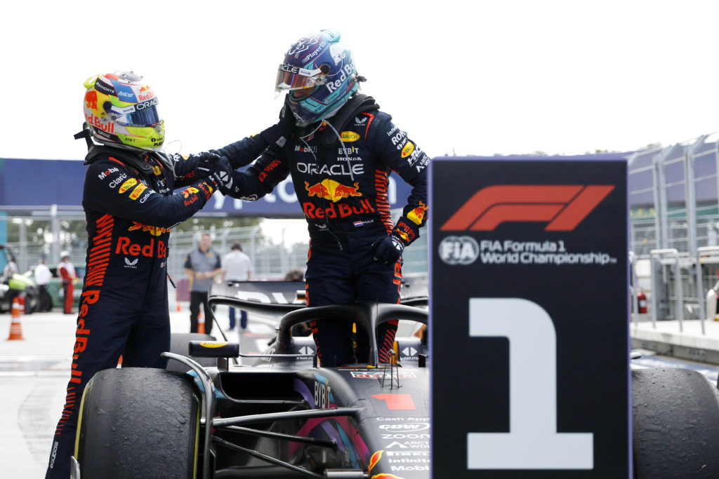 Red Bull driver Sergio Perez congratulates Max Verstappen after winning the 2023 F1 Miami Grand Prix