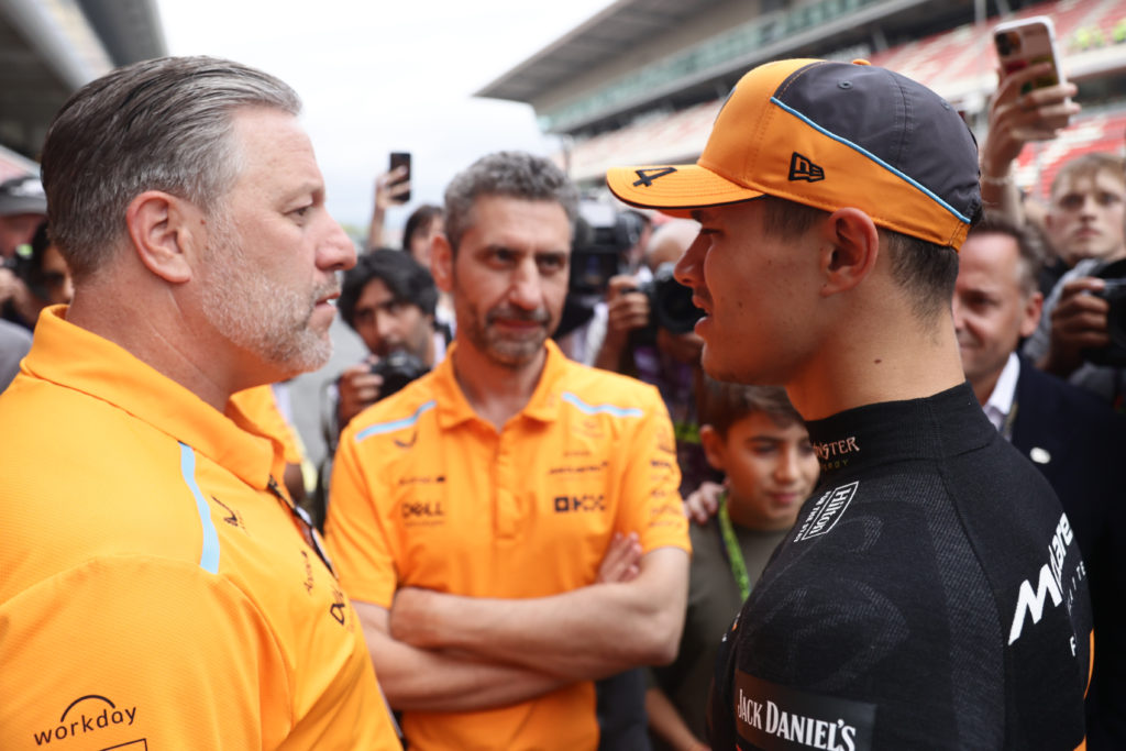 Lando Norris, Andrea Stella and Zak Brown of McLaren talking ahead of the 2024 Spanish Grand Prix