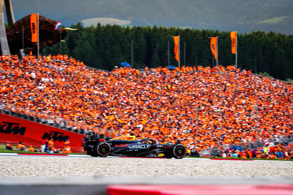 Red Bull's Max Verstappen drives past grandstands of fans wearing orange at the Dutch Grand Prix