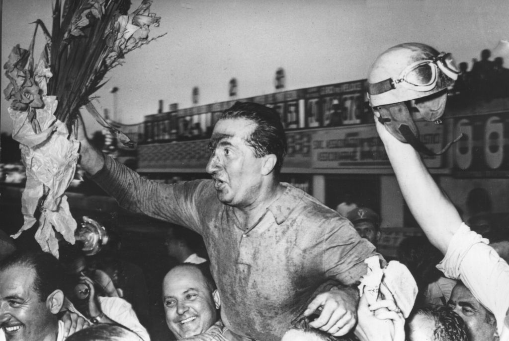 Alberto Ascari of Ferrari celebrates winning his home race at the 1951 Formula 1 Italian Grand Prix at Monza