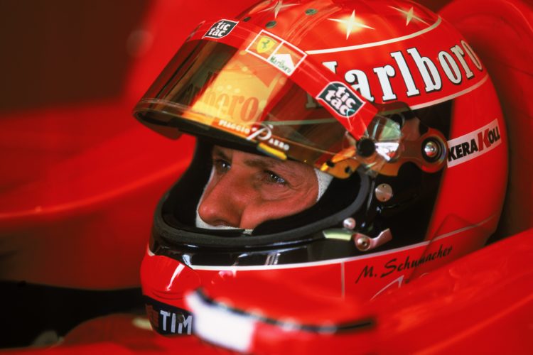 14 Oct 2001:  Ferrari driver Michael Schumacher of Germany waits in the garage before the Formula One Japanese Grand Prix held at Suzuka in Suzuka,...