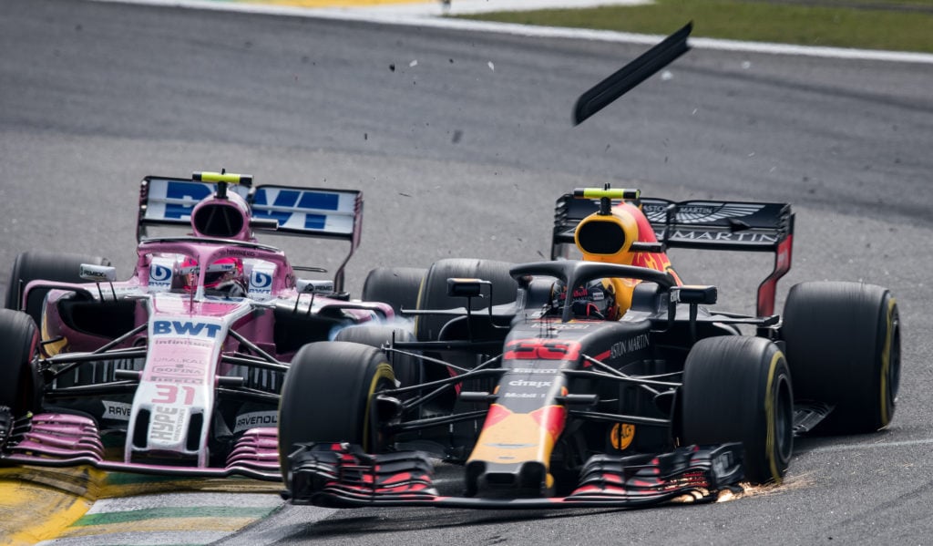 Racing Point driver Esteban Ocon and Max Verstappen of Red Bull crash in the 2018 F1 Brazilian Grand Prix