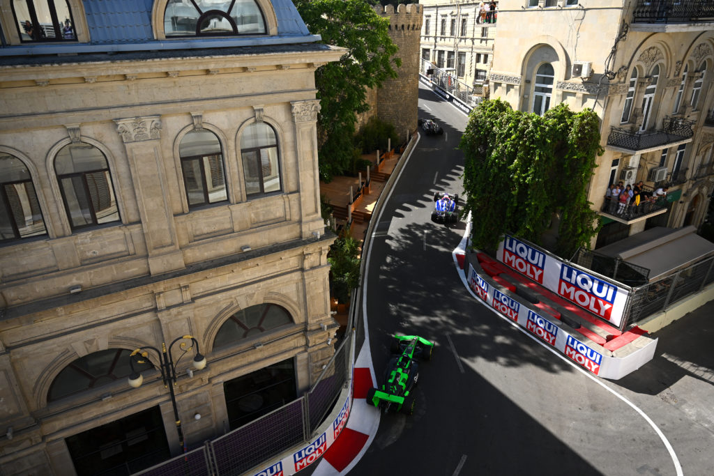 Daniel Ricciardo's VCARB leads Valtteri Bottas' Sauber round the streets of Baku during the Azerbaijan Grand Prix