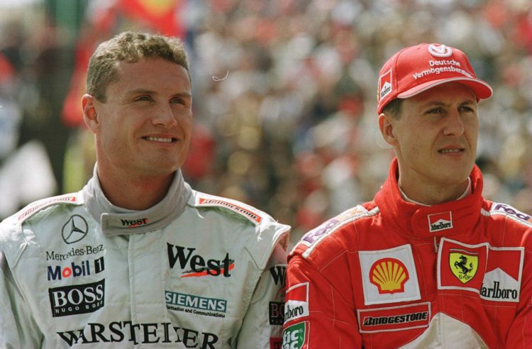 12 Aug 2000: David Coulthard of Great Britain and Michael Schumacher of Germany during the qualifying session for the Hungarian Grand Prix at Budap...