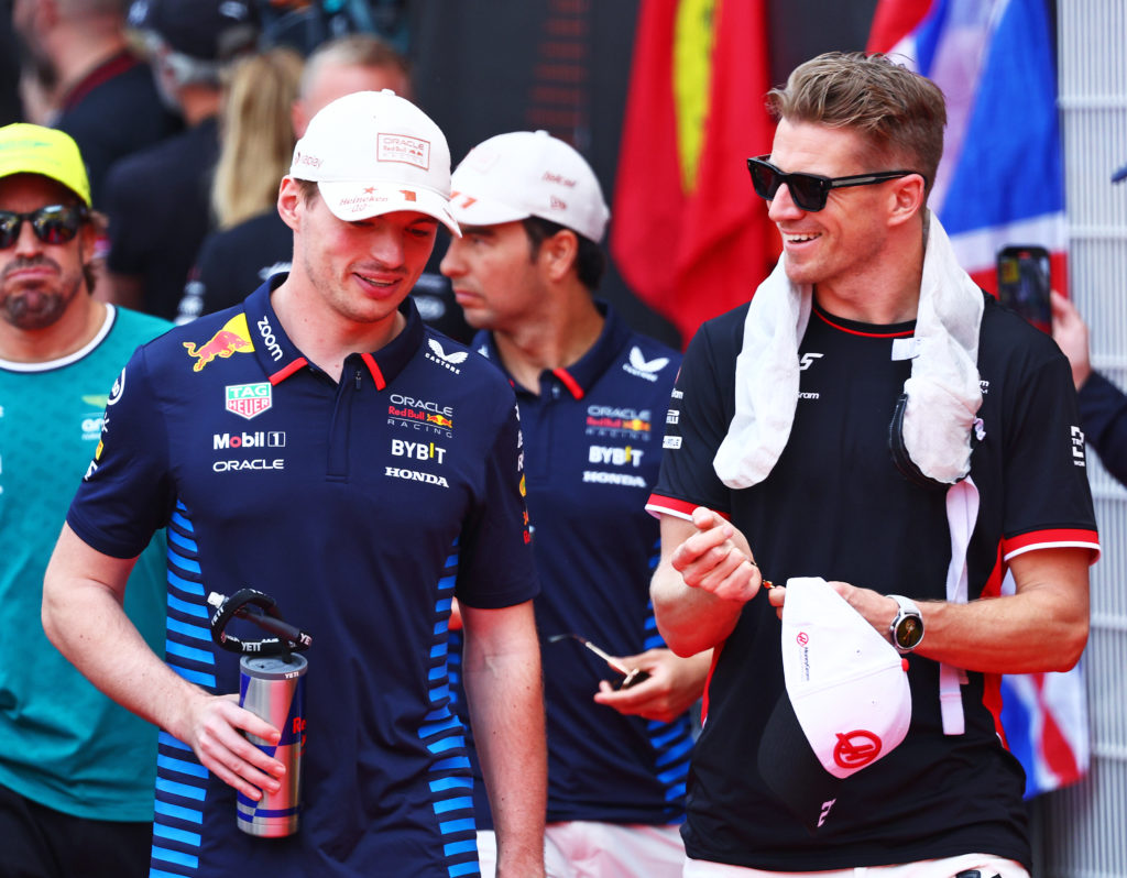 Max Verstappen and Nico Hulkenberg chatting before the Monaco Grand Prix in 2024.