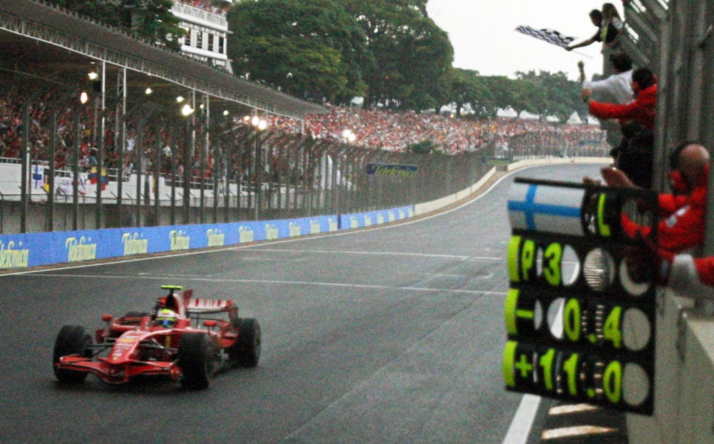 Ferrari F1 driver Felipe Massa crossing the finish line at the 2008 Brazilian Grand Prix.