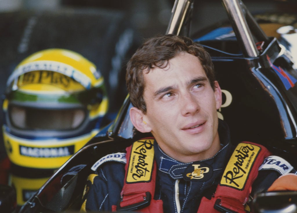 Ayrton Senna sits in his Lotus F1 car during the 1986 Brazilian Grand Prix