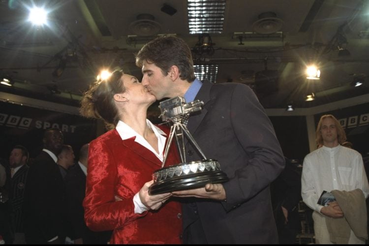 13 Dec 1996:  Damon Hill kisses wife Georgie after winning sport personality of the year during the BBC sports review in London. Mandatory Credit: ...