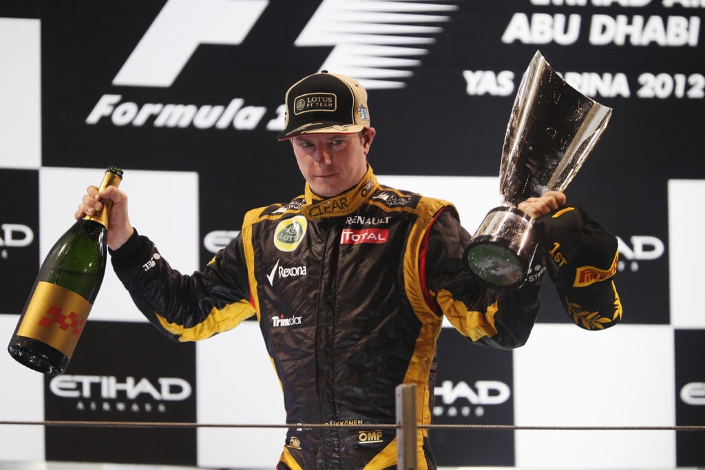 Kimi Raikkonen of Lutus celebrates on the podium after winning the 2012 Abu Dhabi Grand Prix