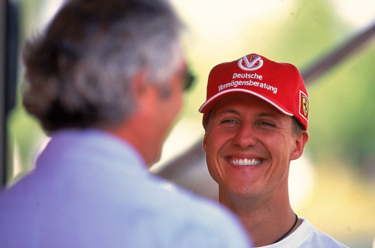 18 Jun 2000:  Michael Schumacher (Germany) of Ferrari talks to Flavio Briatore of Benetton during the Canadian Grand Prix 2000 at Montreal, Canada....