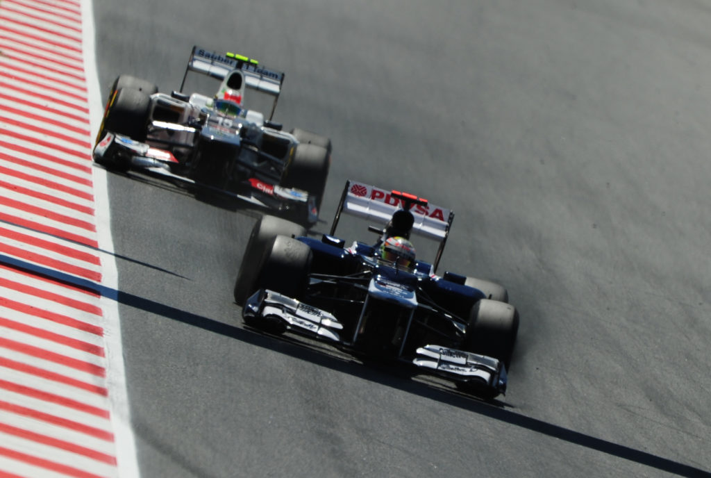 Sauber's Mexican driver Sergio Perez (L)