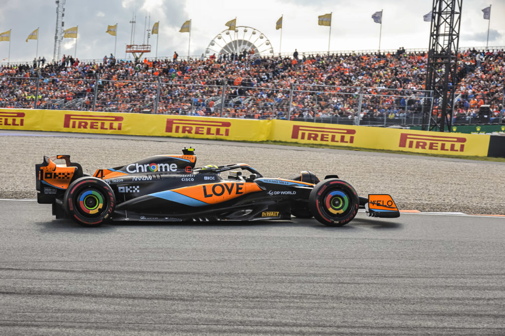 Lando Norris drives past a grandstand at the F1 Grand Prix Of The Netherlands