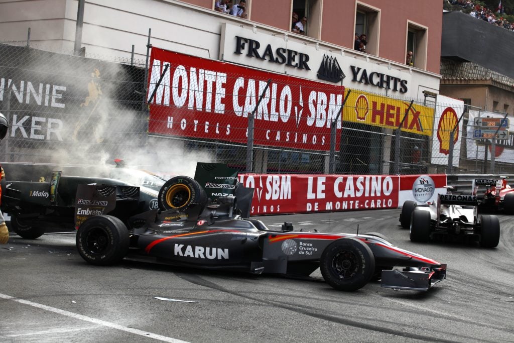 Drivers passe by the crashed car of Lotu