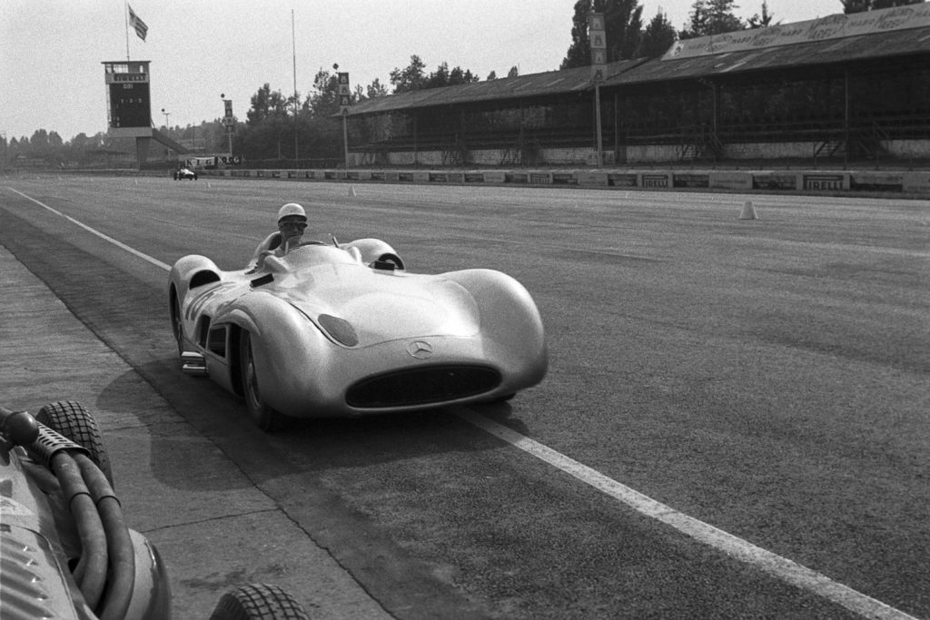 Mercedes driver Stirling Moss approaching the pits during the 1955 F1 Italian Grand Prix at Monza