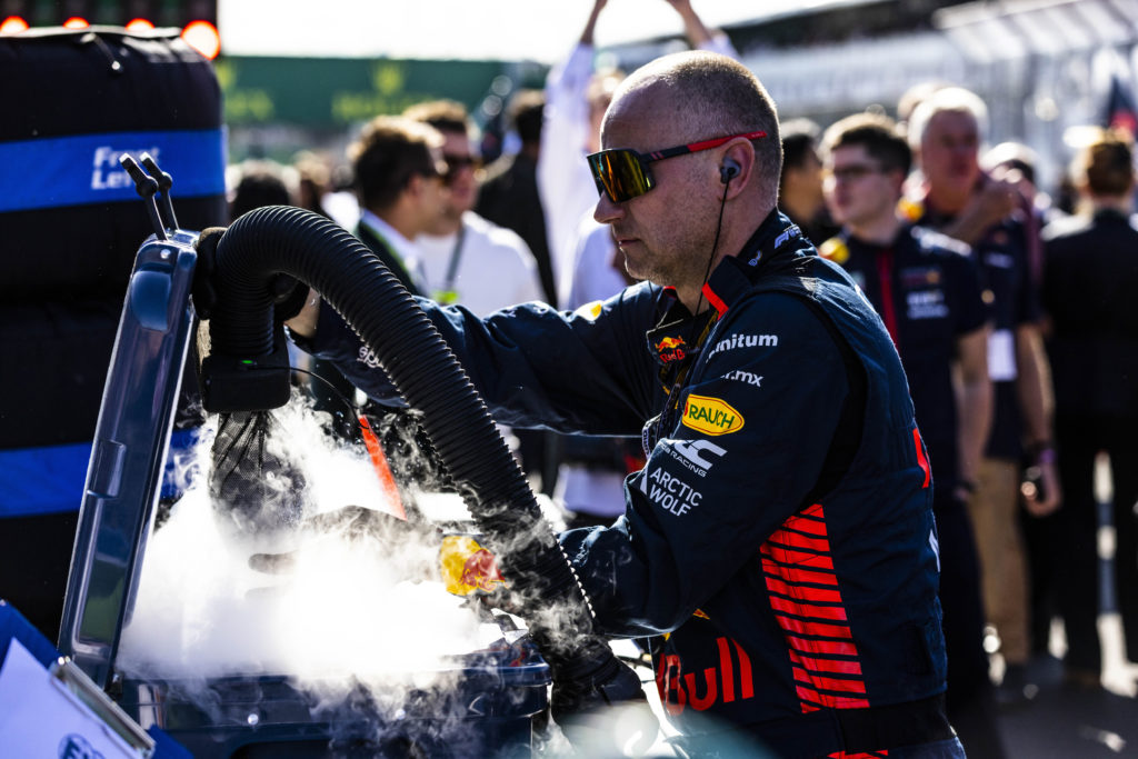 A team member from the Oracle Red Bull Racing Team preparing