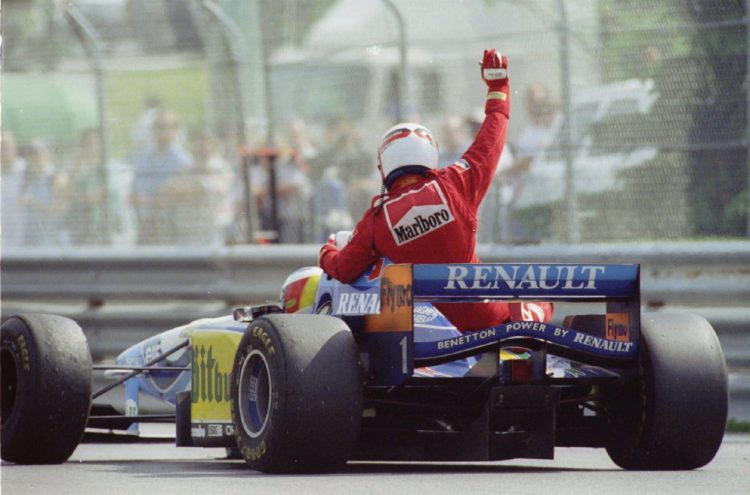 11 JUN 1995:  JEAN ALESI OF FRANCE CELEBRATES HIS FIRST GRAND PRIX VICTORY BY GETTING A LIFT FROM MICHAEL SCHUMACHER OF GERMANY AFTER HE RAN OUT OF...