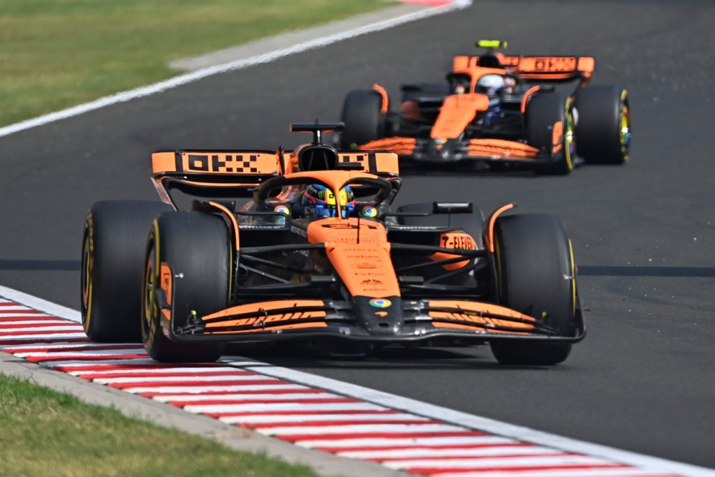 Oscar Piastri leads his McLaren teammate Lando Norris during the F1 Grand Prix of Hungary at the Hungaroring in 2024.