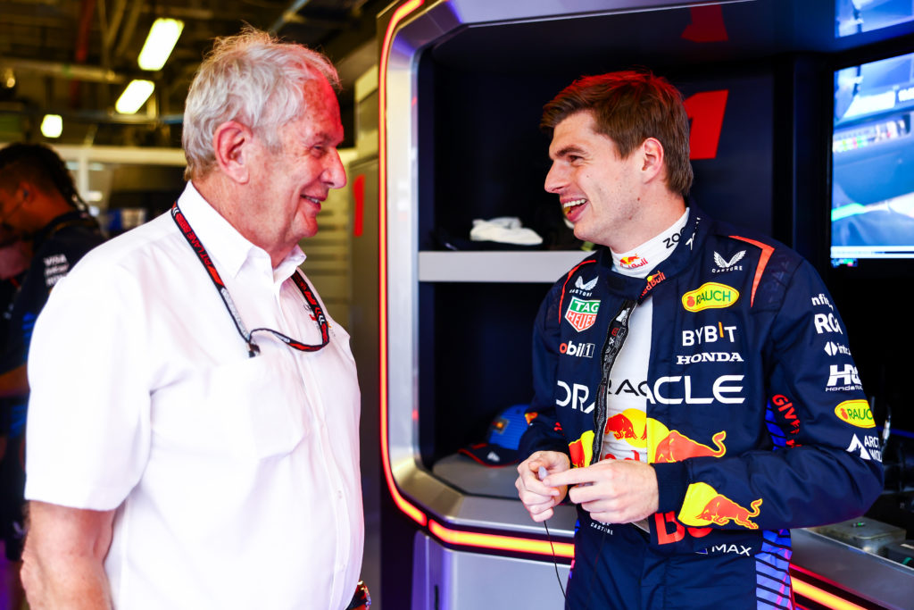 Red Bull chief advisor Helmut Marko and driver Max Verstappen laughing in the garage at the Abu Dhabi Grand Prix