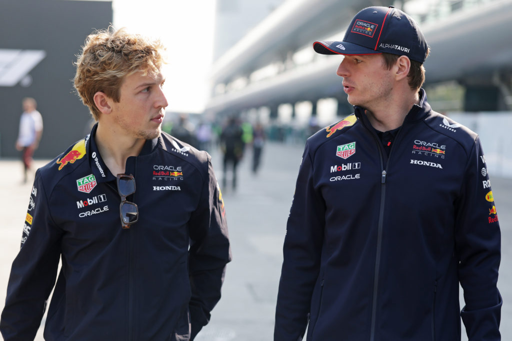 Liam Lawson and Max Verstappen talk in the paddock at the 2025 Chinese Grand Prix