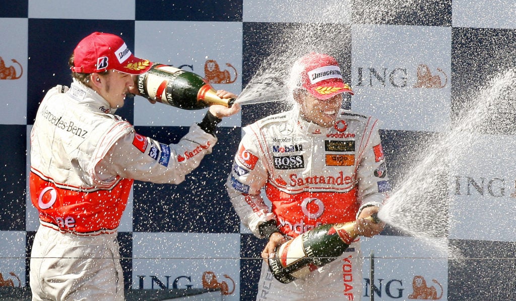 McLaren driver Fernando Alonso (L) of Sp