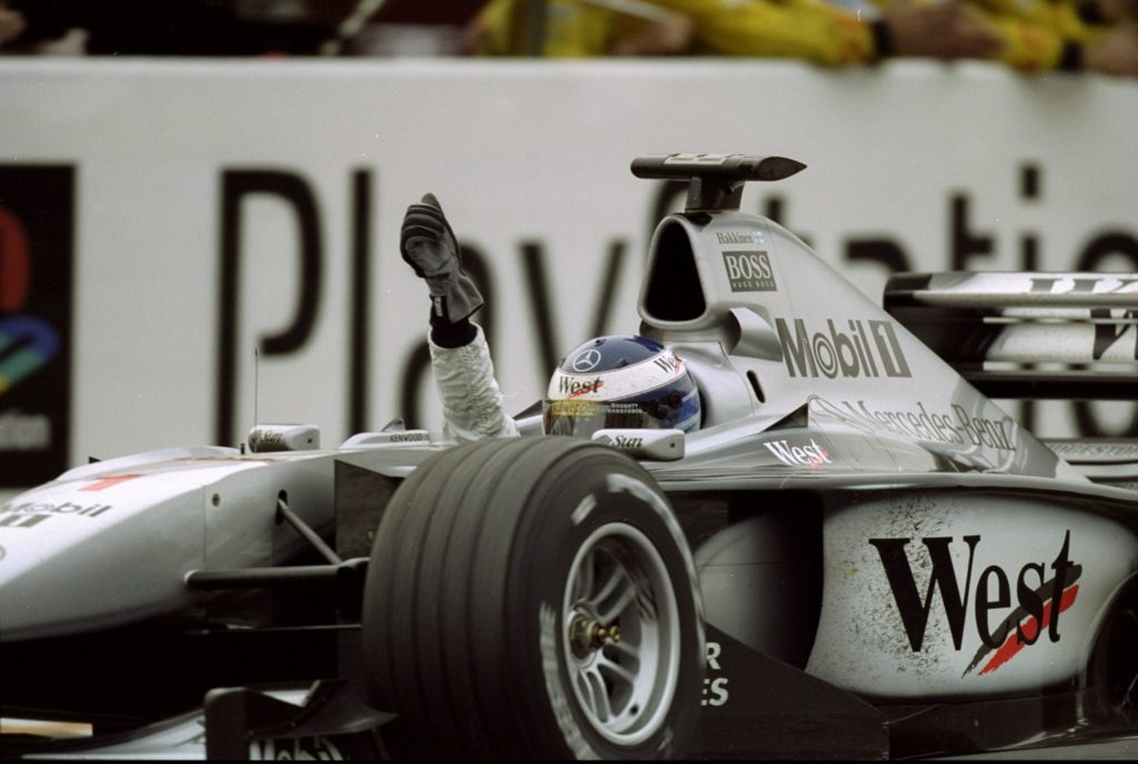 McLaren driver Mika Hakkinen celebrates winning the 1999 F1 Japanese Grand Prix at Suzuka