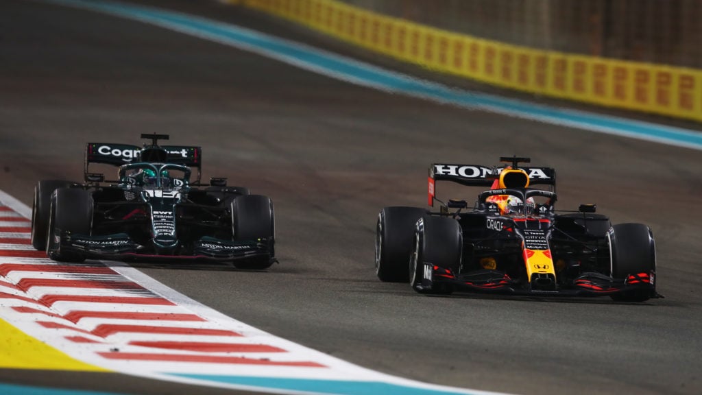 Max Verstappen and Lewis Hamilton battling at the 2021 Abu Dhabi Grand Prix