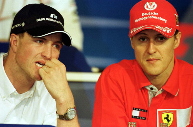21 Jun 2001: Ralf Schumacher of Germany and Williams BMW with his brother Michael Schumacher of Germany and Ferrari during the pre race press confe...