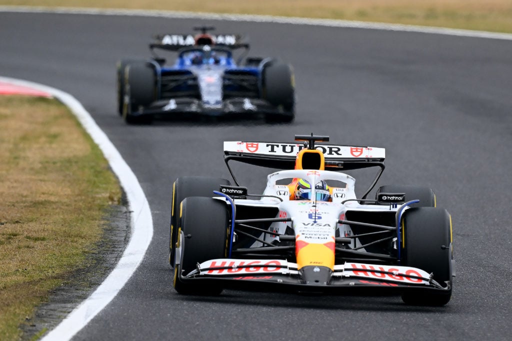 Isack Hadjar of Racing Bulls is followed by Alex Albon of Williams at the 2025 Japanese Grand Prix