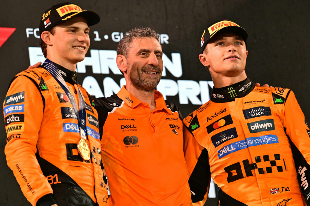 McLaren team principal Andrea Stella with Lando Norris and Oscar Piastri on the podium at the 2025 Bahrain Grand Prix