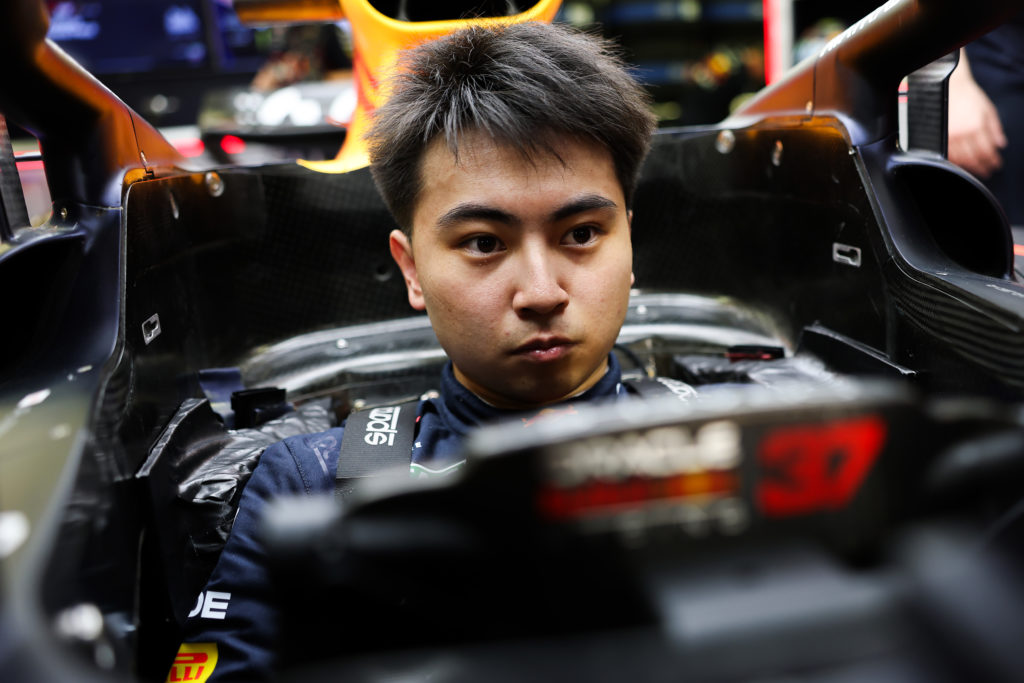 Red Bull reserve driver Ayumu Iwasa gets prepared in Max Verstappen's seat for FP1 for the 2025 F1 Bahrain Grand Prix