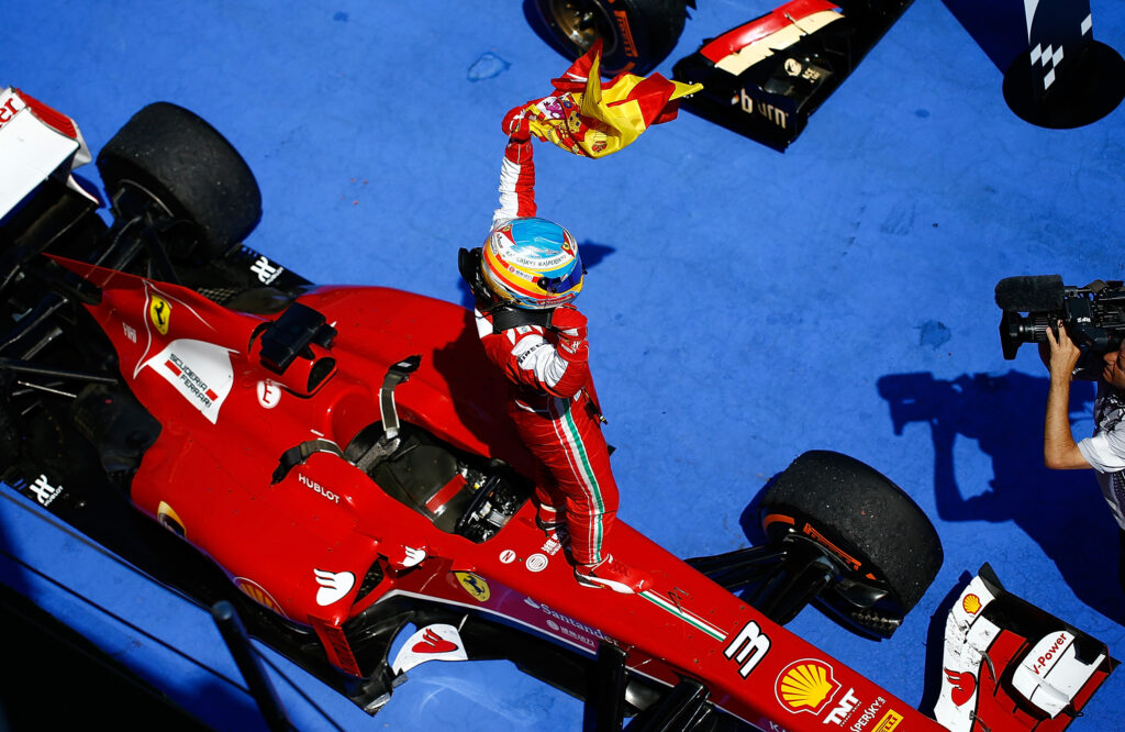 Fernando Alonso celebrates winning the 2013 Spanish Grand Prix for Ferrari