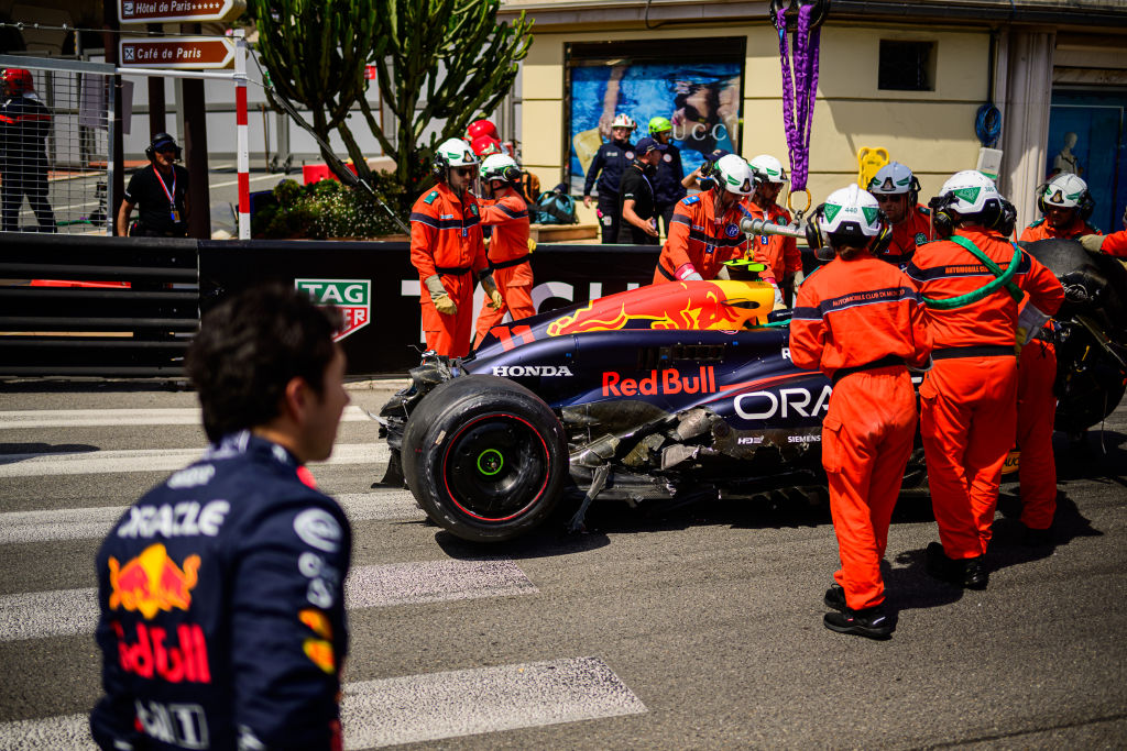 Sergio Perez's Oracle Red Bull Racing car is moved by