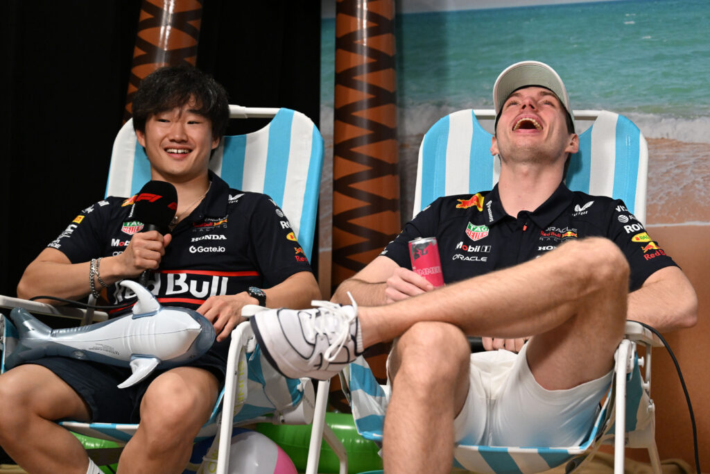 Red Bull Racing drivers Yuki Tsunoda and Max Verstappen laughing at the Miami Grand Prix