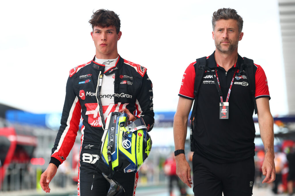 Haas driver Oliver Bearman walks through the pit lane after qualifying for the F1 Miami Sprint