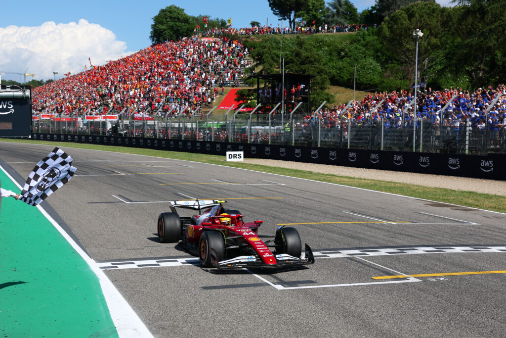 Ferrari driver Lewis Hamilton takes the chequered flag after the 2025 F1 Emilia Romagna Grand Prix at Imola