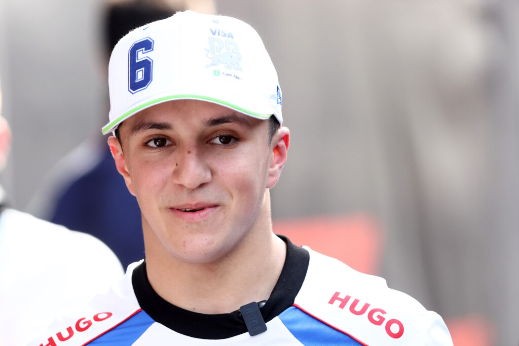 Isack Hadjar of Racing Bulls looks on in the 2025 F1 Monaco Grand Prix paddock